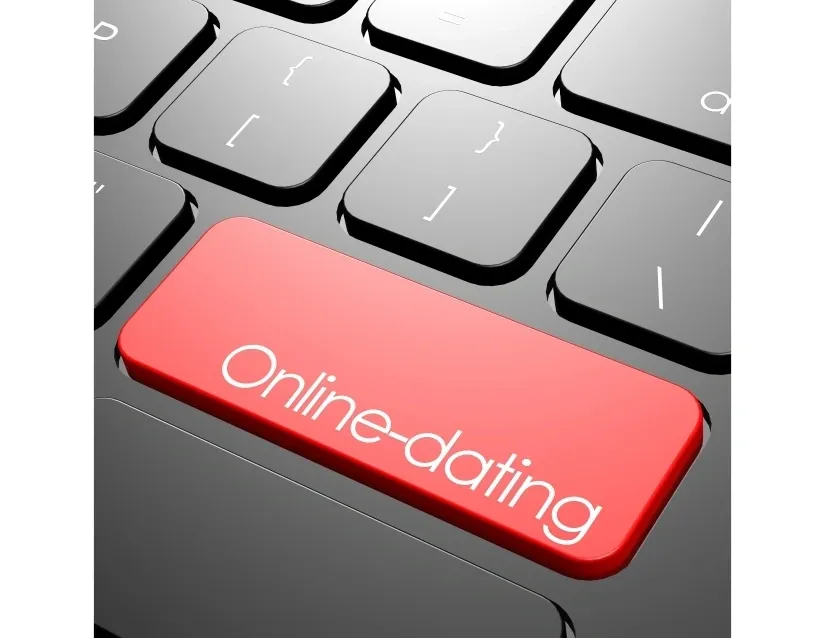 A red button on top of a keyboard that says " online-dating ".